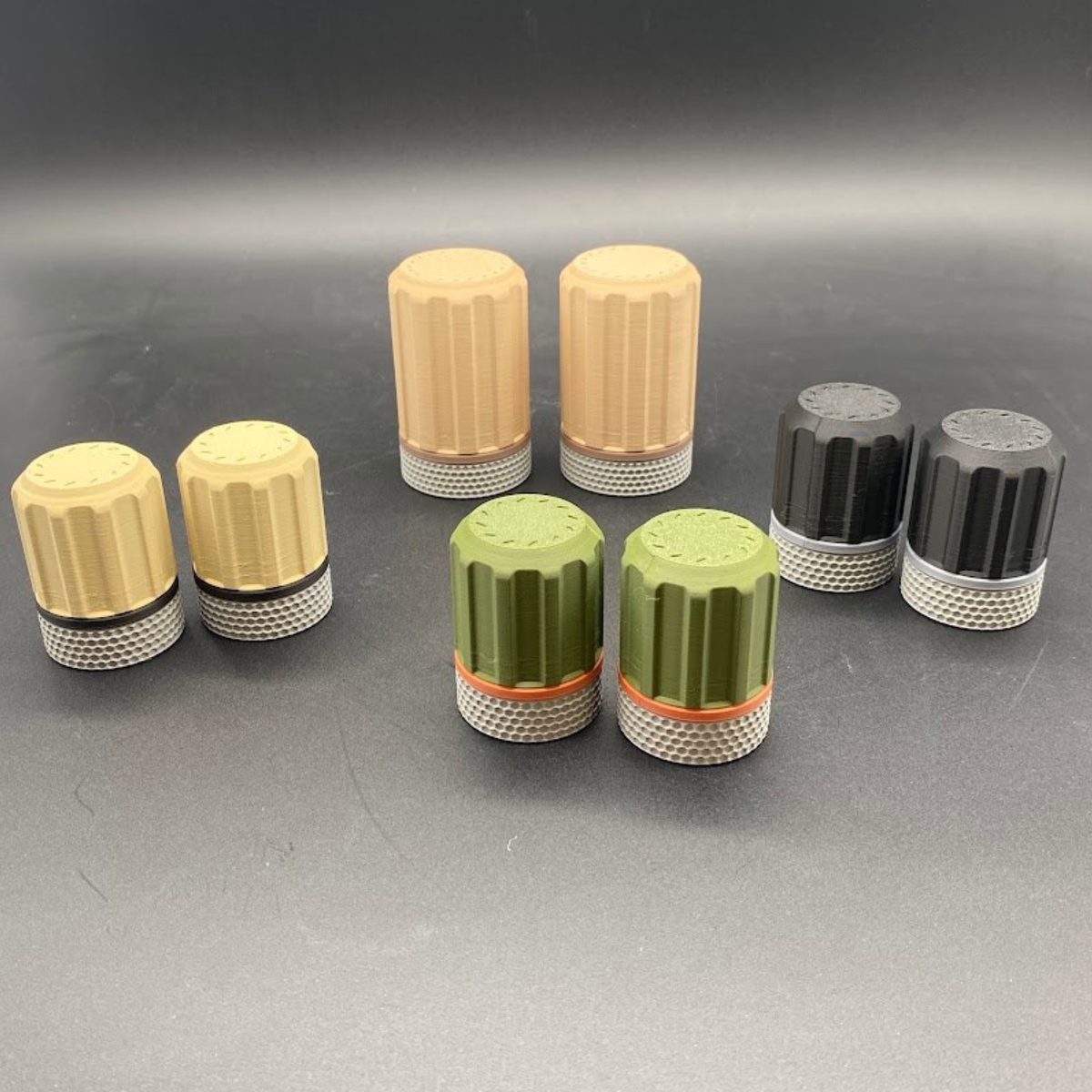 matte dark green and orange; charcoal and ash; matte desert tan and charcoal, matte latte and dark brown