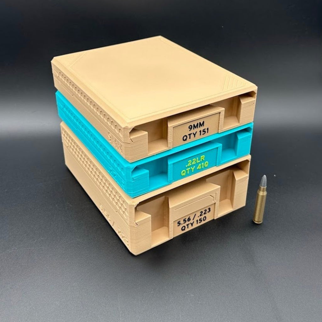 Stack of beige and turquoise ammunition organizer trays with a bullet on a dark background