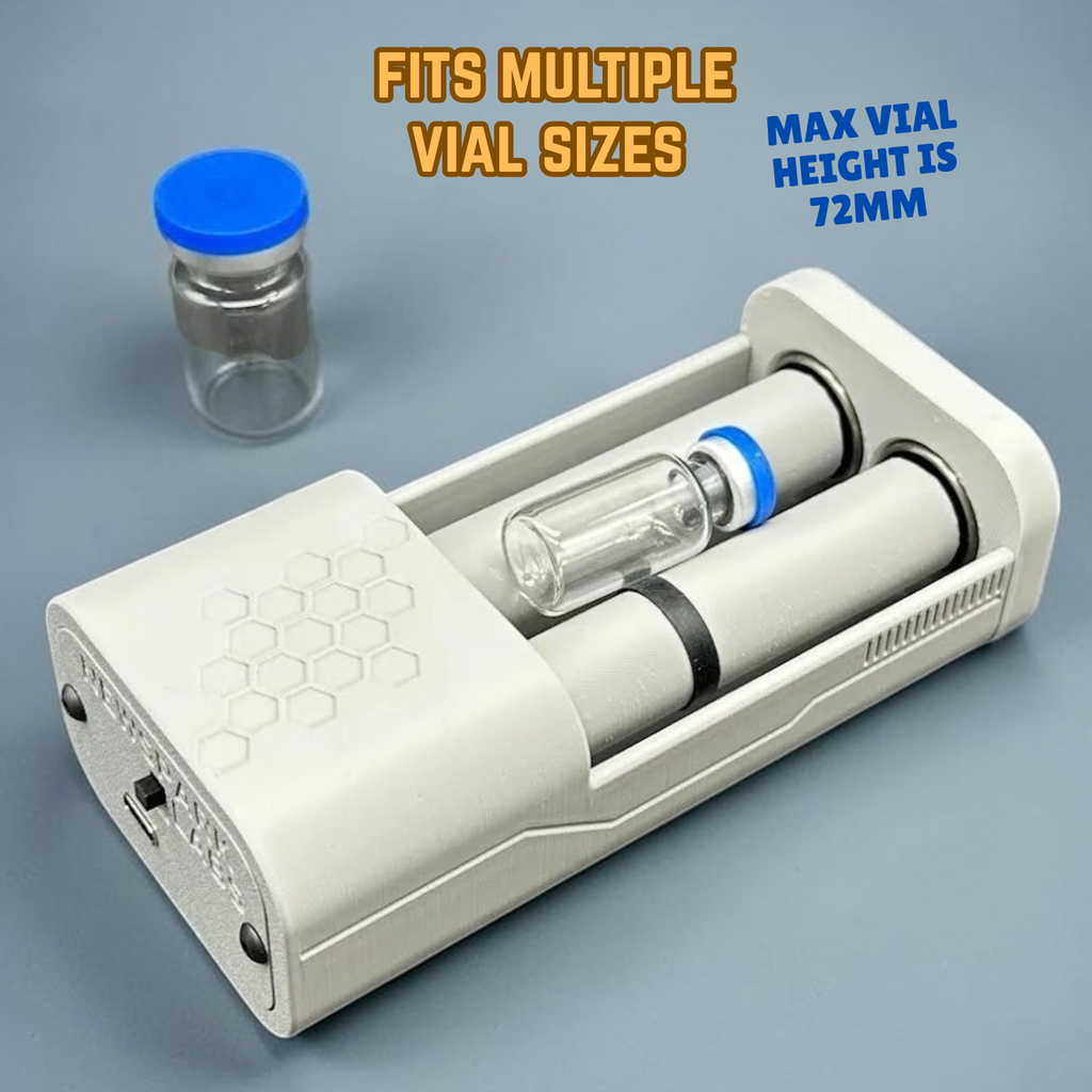 A gray, motorized, vial roller holder shown open on a blue-gray gradient background, with one small glass vial nestled inside between two rollers and one medium vial with a blue cap placed beside it. Text on the image reads 'FITS MULTIPLE VIAL SIZES' and 'MAX VIAL HEIGHT IS 72MM'. A decorative honeycomb motif is etched on top and there are decorative ridges on the side.