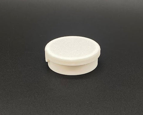 White circular object on a dark gray background