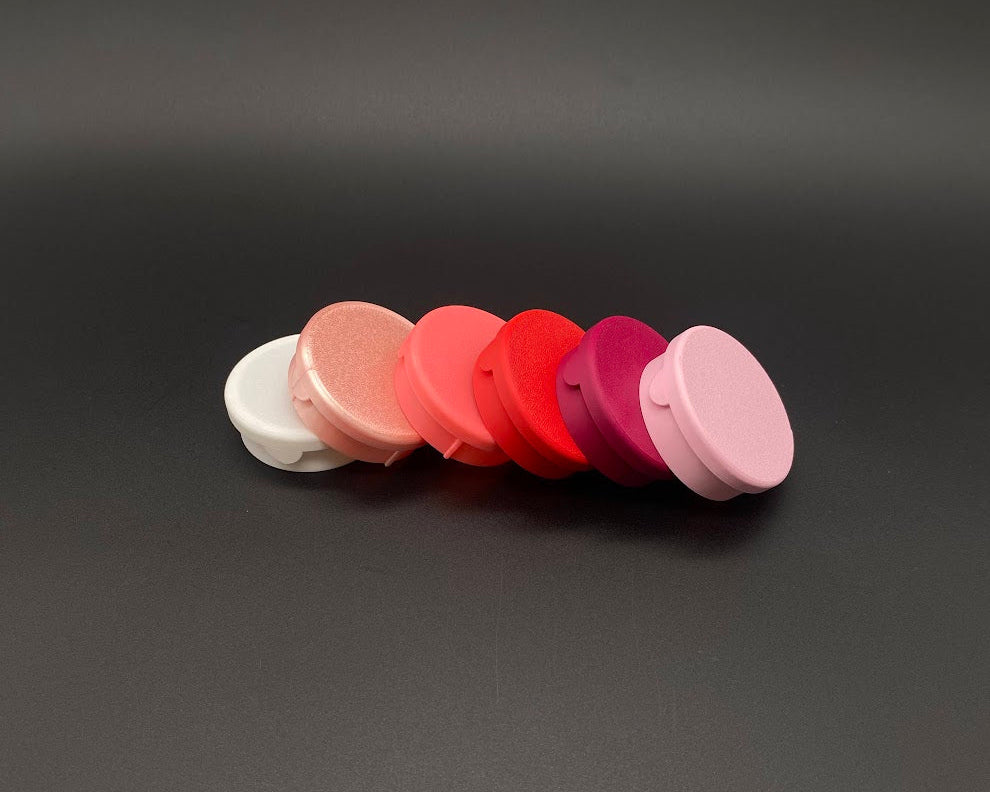 Set of colorful round objects on a dark gray background